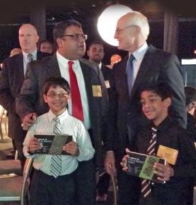 Max Kothari, CEO, Express Kitchens and his sons are congratulated by Harvard Professor Michael Porter at Inner City Awards ceremony held in Boston.