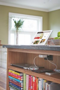 Try putting outlets under a kitchen shelf to create a tucked-away charging station.